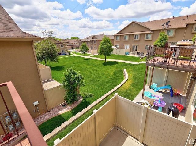 1852 E Whitetail Dr N Unit 106, Layton, UT 84040 - view of grassy yard with a residential view and a balcony