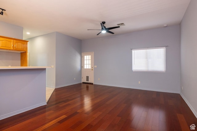 2578 W 225 N, Hurricane, UT 84737 - unfurnished living room featuring dark wood-style floors, ceiling fan, and baseboards