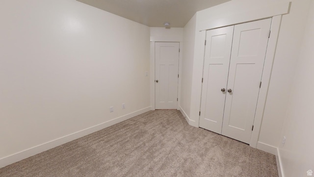 920 S 25 E # 18E, Cedar City, UT 84720 - unfurnished bedroom featuring light carpet, baseboards, and a closet