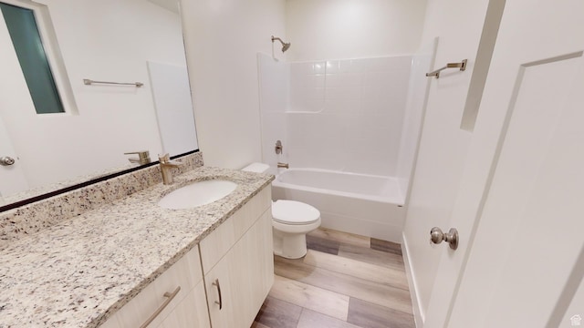 920 S 25 E # 18E, Cedar City, UT 84720 - bathroom featuring wood finished floors, toilet, vanity, and shower / washtub combination