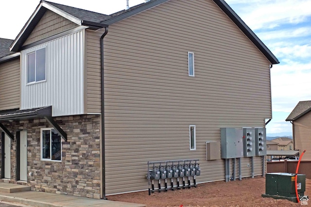 920 S 25 E # 18E, Cedar City, UT 84720 - view of side of home featuring stone siding and central air condition unit
