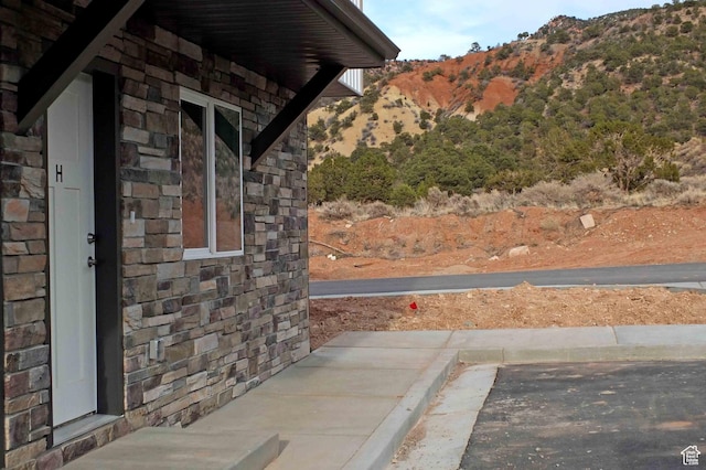 920 S 25 E # 18E, Cedar City, UT 84720 - view of side of home with stone siding and a mountain view