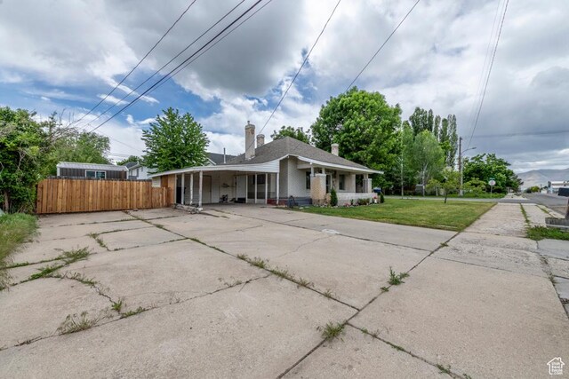 212 E 100 S, Payson, UT 84651 - view of front facade with concrete driveway, a porch, and a chimney