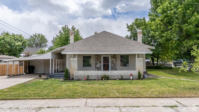 212 E 100 S, Payson, UT 84651 - bungalow-style home with brick siding, a porch, a chimney, and an attached carport