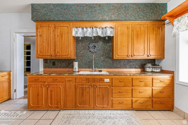 212 E 100 S, Payson, UT 84651 - kitchen featuring a sink, light tile patterned floors, and brown cabinetry