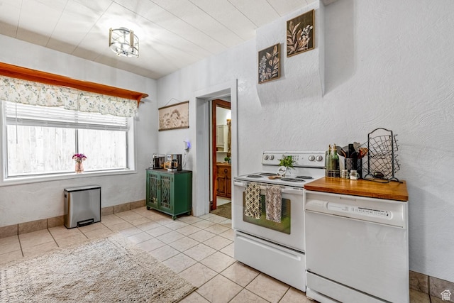 212 E 100 S, Payson, UT 84651 - kitchen featuring white appliances, light tile patterned floors, and light countertops