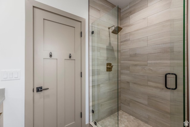 bathroom with a shower stall