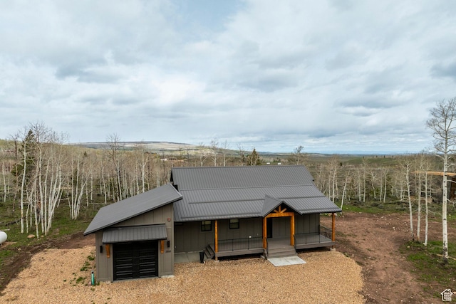 view of outbuilding with a garage and covered porch