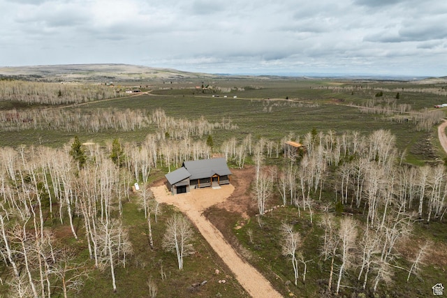 aerial view of property and surrounding area featuring rural landscape