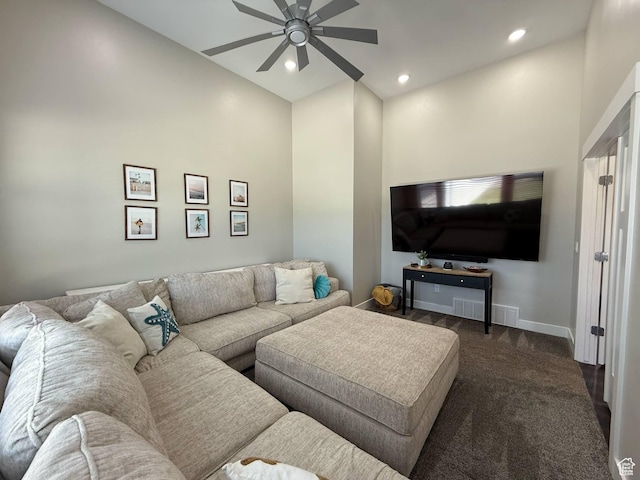 living room with ceiling fan, dark carpet, high vaulted ceiling, baseboards, and recessed lighting
