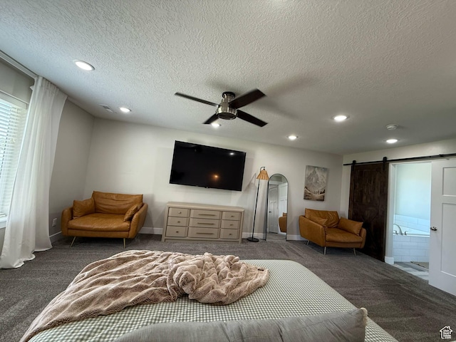 bedroom with carpet flooring, recessed lighting, baseboards, a textured ceiling, and a barn door