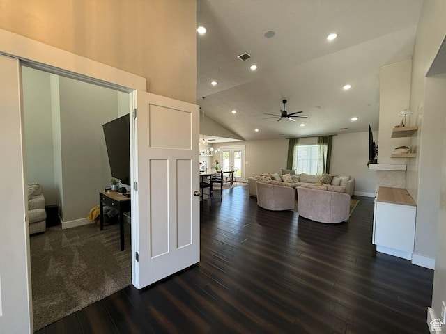 living area with dark wood-style flooring, a ceiling fan, recessed lighting, baseboards, and lofted ceiling