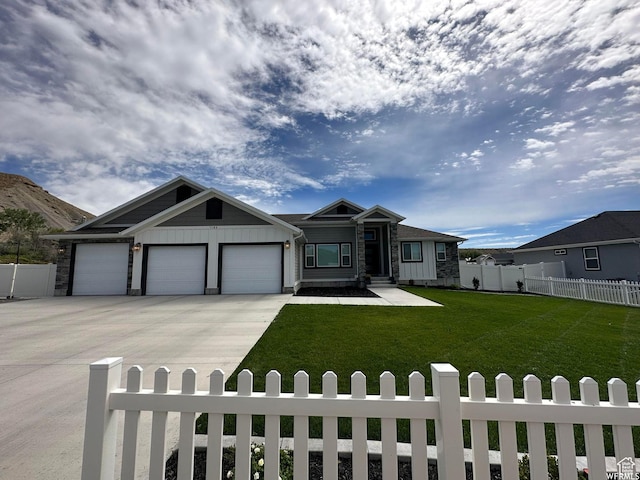 view of front facade with a garage, driveway, and board and batten siding