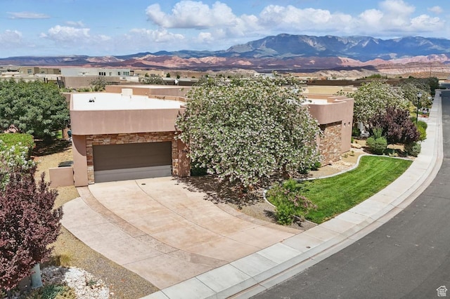 3258 S 4900 W, Hurricane, UT 84737 - pueblo-style house with a mountain view, stucco siding, stone siding, and driveway