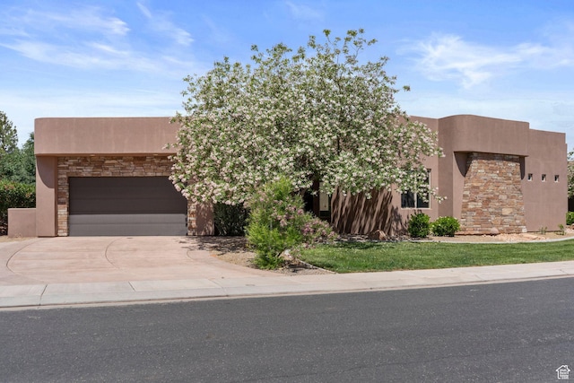 3258 S 4900 W, Hurricane, UT 84737 - adobe home featuring stucco siding, a garage, stone siding, and driveway