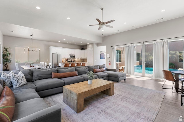 3258 S 4900 W, Hurricane, UT 84737 - living room with a ceiling fan, recessed lighting, light wood finished floors, and a chandelier
