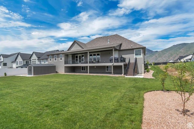 487 W 500 N, Mapleton, UT 84664 - back of house with a storage shed, stucco siding, stairway, an outdoor structure, and a shingled roof
