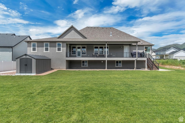 487 W 500 N, Mapleton, UT 84664 - rear view of house featuring a storage unit, stucco siding, an outbuilding, and a lawn