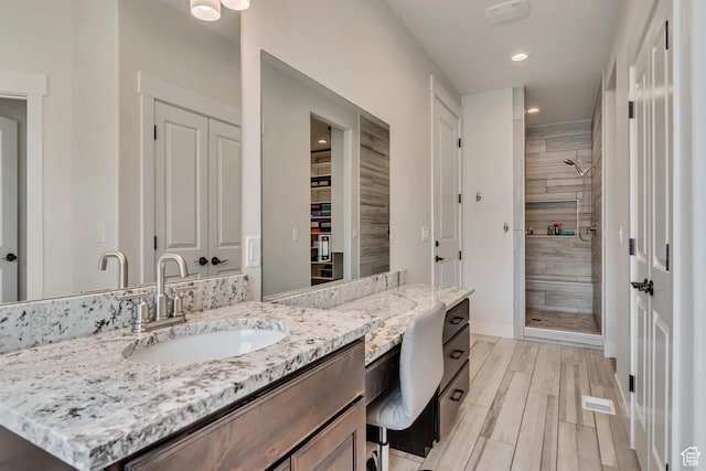 487 W 500 N, Mapleton, UT 84664 - full bath with a tile shower, recessed lighting, a closet, vanity, and wood finished floors