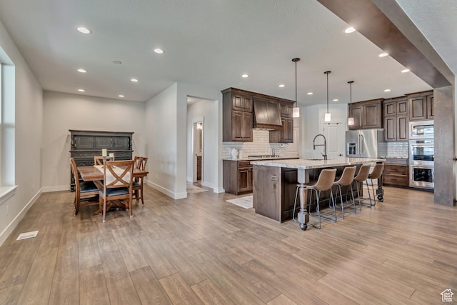487 W 500 N, Mapleton, UT 84664 - kitchen featuring baseboards, light wood finished floors, stainless steel appliances, backsplash, and recessed lighting