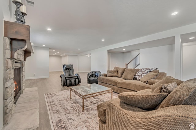 487 W 500 N, Mapleton, UT 84664 - living room featuring recessed lighting, stairs, baseboards, light wood-style flooring, and a stone fireplace