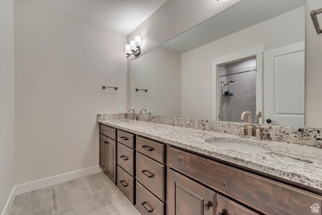 487 W 500 N, Mapleton, UT 84664 - full bathroom featuring a tile shower, baseboards, and double vanity