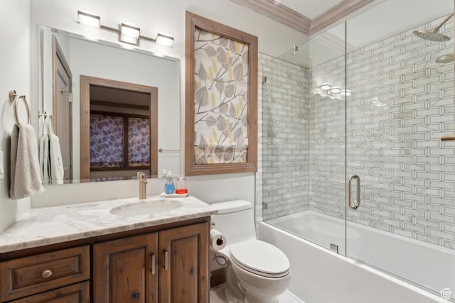 full bath with vanity, shower / bath combination with glass door, toilet, and ornamental molding