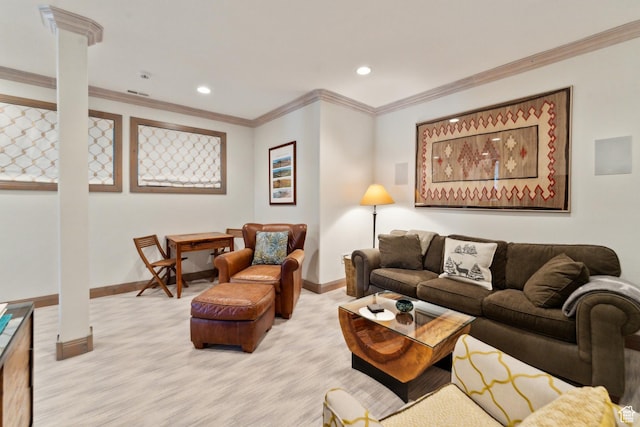 living area featuring baseboards, ornate columns, recessed lighting, and crown molding