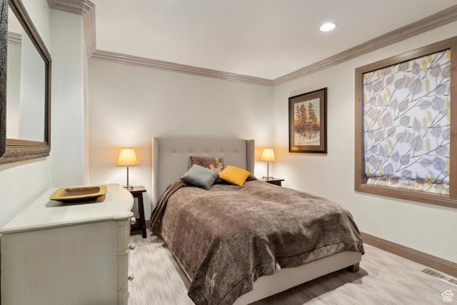 bedroom featuring baseboards, light wood-type flooring, ornamental molding, and recessed lighting
