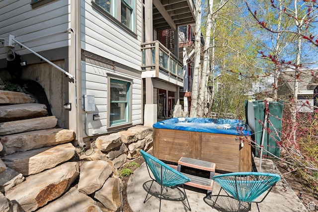 view of patio / terrace with a hot tub