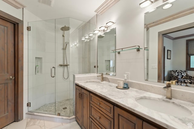full bathroom featuring a stall shower and double vanity