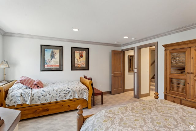 bedroom featuring ornamental molding, baseboards, and recessed lighting