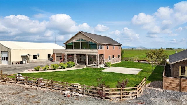 3703 W 600 S, Logan, UT 84321 - back of house featuring stone siding and a garage