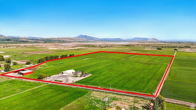 3703 W 600 S, Logan, UT 84321 - aerial view of sparsely populated area with property parcel outlined and a mountain backdrop