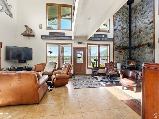 3703 W 600 S, Logan, UT 84321 - tiled living room with a wood stove and a towering ceiling