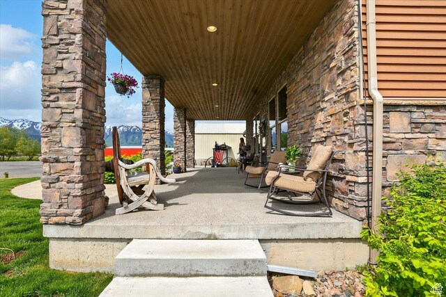 3703 W 600 S, Logan, UT 84321 - view of patio / terrace with a porch and a mountain view