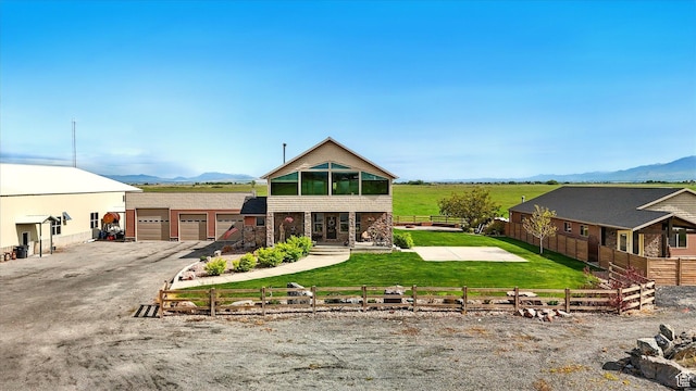 3703 W 600 S, Logan, UT 84321 - view of front of property with a mountain view, stone siding, and a detached garage