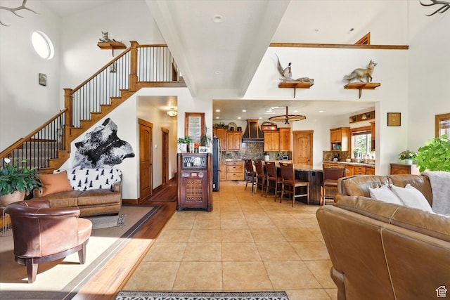 3703 W 600 S, Logan, UT 84321 - living room with stairway, a high ceiling, and light tile patterned flooring