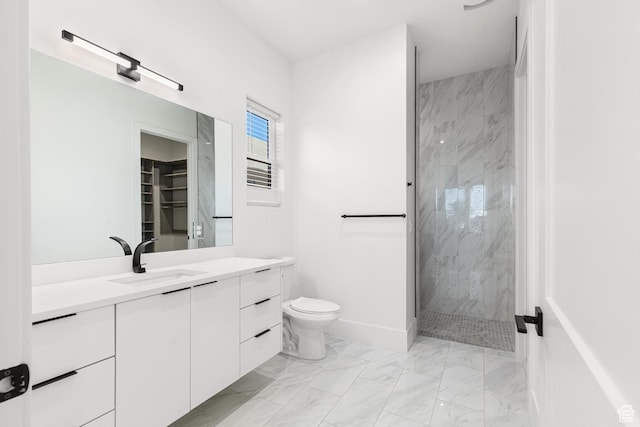 147 E Terrace Ln, Ivins, UT 84738 - bathroom featuring marble look tile flooring, a marble finish shower, vanity, and toilet