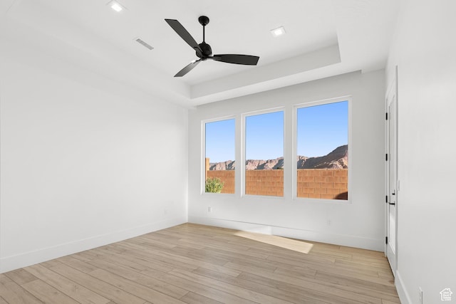 147 E Terrace Ln, Ivins, UT 84738 - spare room featuring a ceiling fan, light wood finished floors, baseboards, a raised ceiling, and recessed lighting