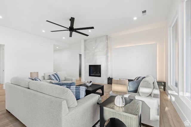 147 E Terrace Ln, Ivins, UT 84738 - living area featuring light wood finished floors, ceiling fan, recessed lighting, a fireplace, and baseboards