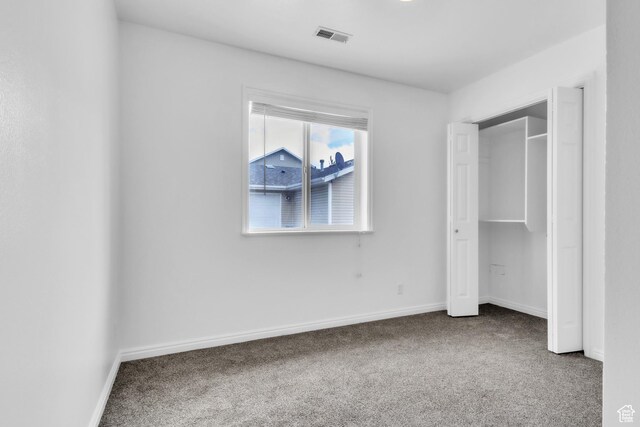 876 S Park Ave, Logan, UT 84321 - unfurnished bedroom with carpet flooring and baseboards