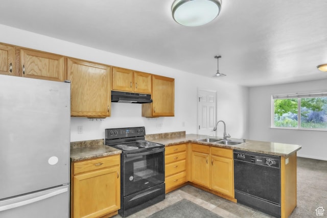 876 S Park Ave, Logan, UT 84321 - kitchen with black appliances, a sink, under cabinet range hood, a peninsula, and dark countertops