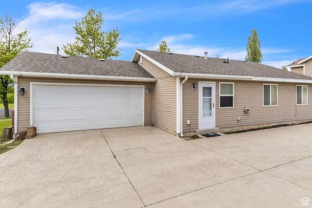 876 S Park Ave, Logan, UT 84321 - ranch-style home with roof with shingles, driveway, and a garage