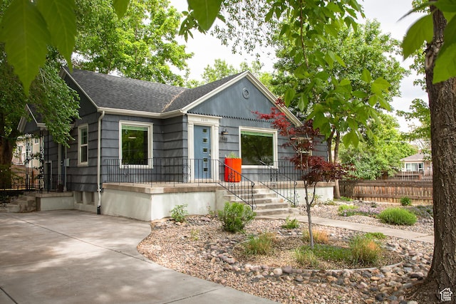 2848 S 500 E, South Salt Lake, UT 84106 - ranch-style house featuring roof with shingles and fence