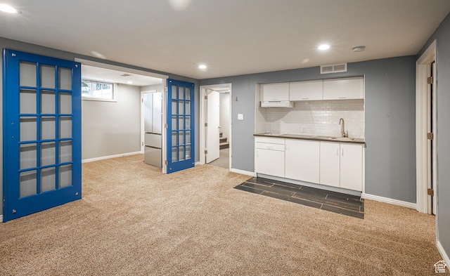 2848 S 500 E, South Salt Lake, UT 84106 - kitchen featuring carpet, a sink, white cabinets, recessed lighting, and decorative backsplash