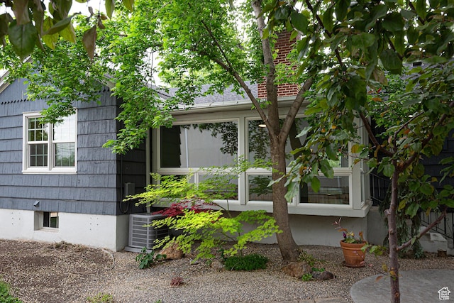 2848 S 500 E, South Salt Lake, UT 84106 - view of property exterior with central AC and a sunroom