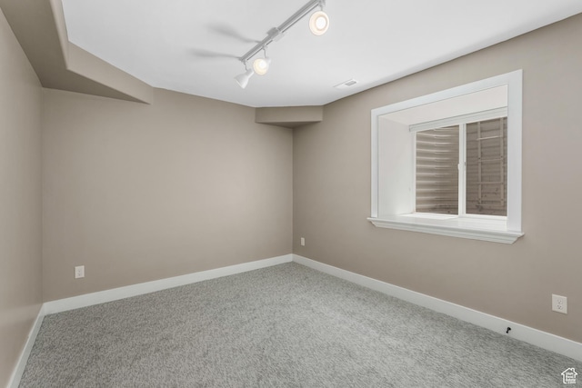 225 S 900 E, Salt Lake City, UT 84102 - unfurnished room featuring carpet, rail lighting, and baseboards