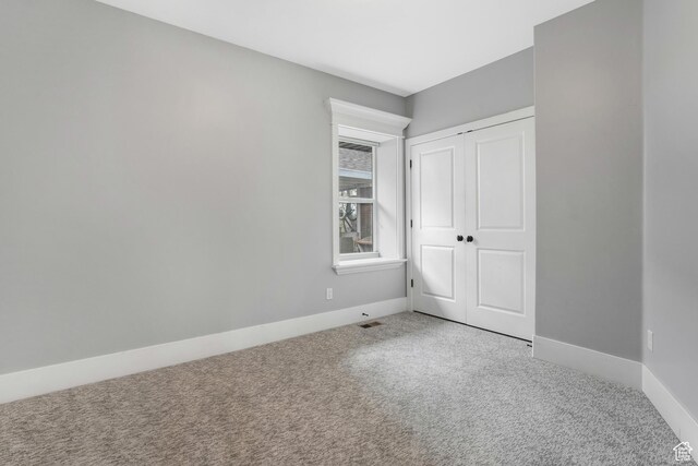 225 S 900 E, Salt Lake City, UT 84102 - unfurnished bedroom featuring carpet, baseboards, and a closet