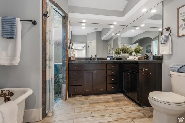 225 S 900 E, Salt Lake City, UT 84102 - bathroom with toilet, recessed lighting, a stall shower, double vanity, and a freestanding tub